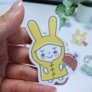 Sticker - Regenmantel Bunnies \ kleine süße Kaninchen Aufkleber, Bunnies Aufkleber, Journal Planner Aufkleber, Laptop Aufkleber, Kawaii Aufkleber