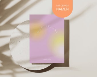 May include: A pink and yellow gradient card with the text "MIT DEINEM NAMEN" in a peach-colored circle at the top and the text "KARLA GLÜCK" at the bottom.