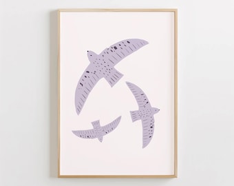 May include: A framed print featuring three stylized birds in flight. The birds are a pale lavender color with black markings and are set against a white background.