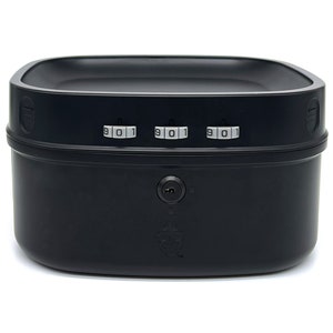 May include: A black, square-shaped storage container with a combination lock and keyhole. The combination lock displays the numbers 301. The container has a rounded top and a smooth, matte finish. The background is white.