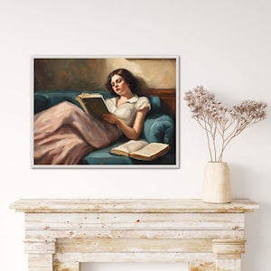 May include: A painting of a woman in a pink dress reading a book while reclining on a blue couch.