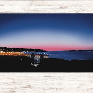 Enchanting Coastal Sunset with City Lights : Digital Illustration