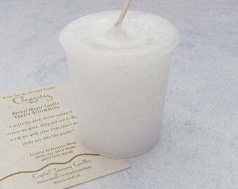 May include: White votive candle with a wooden wick, labeled "Cleansing Herbal Magic Candle Candle Affirmation" and "I invite the pure, divine energy to cleanse my mind, body and spirit. May it fill me with clear light that I may shine out into the world."  Essential Oil Fragrance Blend: white sage, white thyme, white birch, hyssop. Crystal Journey Candles. Unique Candles for Unique Individuals. Made in the U.S.A.