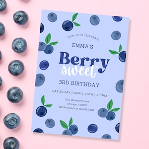 May include: A blue and white birthday invitation with a blueberry theme. The invitation says "Join us to celebrate Emma's Berry Sweet 3rd Birthday" and includes the date, time, and location of the party.