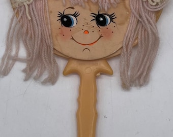 Vintage Child’s Hand Held Vanity Mirror Kitschy Doll Face Plastic Handle
