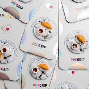 Soportes para móviles de Croissant Cafe