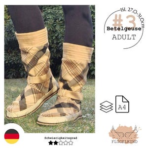 May include: Mid-calf boots featuring a beige, brown, and black plaid pattern with a horizontal strap across the ankle and a ribbed cuff. The text #3 Betelgeuse ADULT ISL 27.0-31.0cm is visible, along with an A4 paper icon and a wing logo labeled FLÜGELKIND.