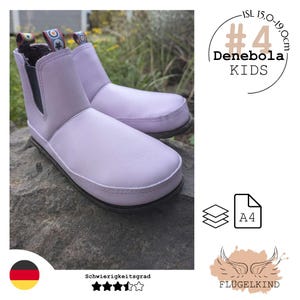 May include: A pair of light purple ankle boots with black elastic side panels and patterned pull tabs. The text #4 Denebola KIDS is visible, along with a measurement range of 15.0-19.0cm. The boots feature a rounded toe and a dark, flat sole.