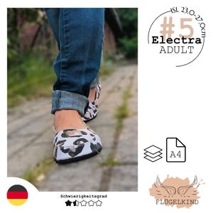 May include: A pair of white slip-on shoes featuring a black and brown leopard print pattern. The shoes are worn with cuffed blue denim jeans. Text on the image includes #5 Electra ADULT, A4, and FLÜGELKIND, with a size range of 23.0-27.0cm.