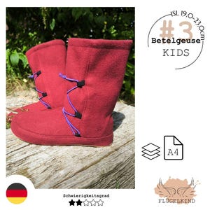 May include: A pair of red mid-calf boots featuring purple elastic lacing with black toggles. The text on the image includes #3, Betelgeuse, KIDS, and ISL 19.0-23.0cm. The boots have a flat sole and a soft, textured exterior finish.