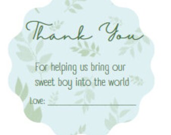 May include: A light blue, scalloped-edge card with a floral pattern and the words "Thank You" in green script. The text below reads, "For helping us bring our sweet boy into the world." There is a space for a name, followed by "Love:"