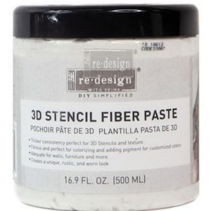 May include: A white container of 3D Stencil Fiber Paste with a black lid. The label features the text "re-design" and "3D STENCIL FIBER PASTE". The container holds 16.9 fl oz (500 ml) of paste, suitable for stencils and adding texture.