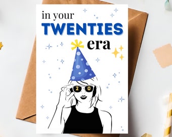 May include: A rectangular greeting card featuring a line-art illustration of a person wearing a blue polka-dot party hat and sunglasses with the number 20 on the lenses. The text reads in your TWENTIES era, surrounded by small star icons.