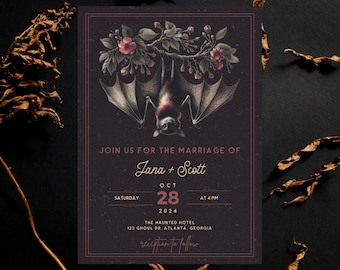 May include: A black and white wedding invitation with a bat hanging from a branch with pink flowers. The text reads "Join us for the marriage of Jana + Scott, Saturday, Oct 28, 2024 at 4pm, The Haunted Hotel, 123 Ghoul Dr Atlanta, Georgia, reception to follow."