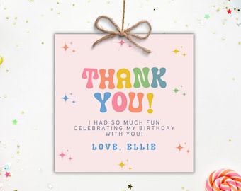 May include: A pink square card with the words "THANK YOU!" in colourful retro font. The text "I HAD SO MUCH FUN CELEBRATING MY BIRTHDAY WITH YOU! LOVE, ELLIE" is below. The card is tied with twine.