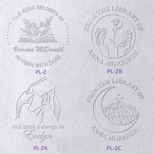 May include: Four circular embossed designs on white paper. Top left: open book with flowers, text 'THIS BOOK BELONGS TO Veronica McDonald RETURN WITH CARE'. Top right: hands holding a flower, text 'FROM THE LIBRARY OF ANNA MORRISON'. Bottom left: person reading, text 'this book belongs to Evelyn'. Bottom right: crescent moon and mountains, text 'FROM THE LIBRARY OF ANNA MORRISON'.