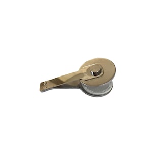 May include: A silver-toned metal library book return stamp featuring a circular head with a central pivot point and a flat, elongated handle. The circular base displays embossed text that reads RETURN TO LIBRARY OF.