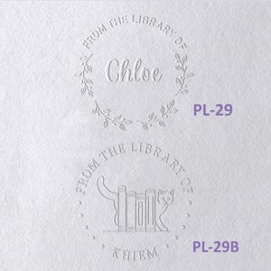 May include: Two circular embossed designs on white paper. The top design features a leaf wreath, the text FROM THE LIBRARY OF, and the name Chloe. The bottom design shows a cat beside books, the text FROM THE LIBRARY OF, and the name KHIEM.