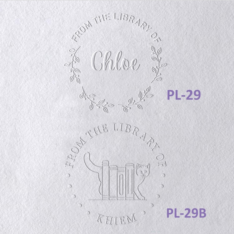 May include: Two circular embossed designs on white paper. The top design features a leaf wreath, the text FROM THE LIBRARY OF, and the name Chloe. The bottom design shows a cat beside books, the text FROM THE LIBRARY OF, and the name KHIEM.