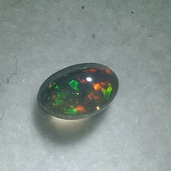 Rare Natural Black Ethiopian Fire Opal Cabachon rare flash of colors red, green, yellow orange Gemstone Oval cabachon fire opal Black Opal