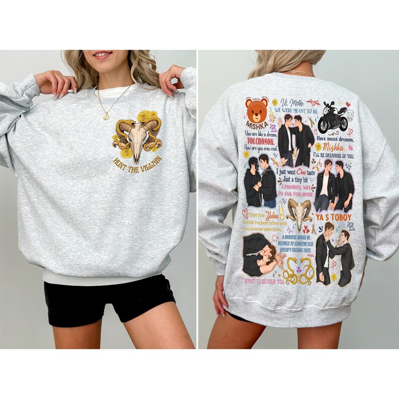 May include: A light gray sweatshirt with the text "HUNT THE VILLAIN" and a ram skull graphic on the front. The back of the sweatshirt features various illustrations and text, including "MISHKA" and "YA S TOBOY".