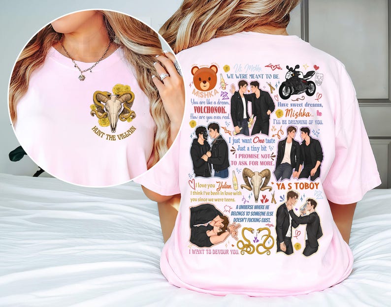 May include: A light pink t-shirt featuring a graphic design. The front of the shirt has a skull with horns and the text "HUNT THE VILLAIN". The back of the shirt has illustrations of two men, a motorcycle, and text.