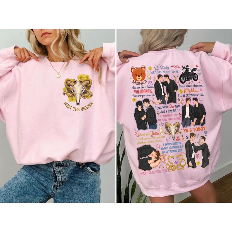 May include: Pink sweatshirt with a graphic on the front featuring a skull with horns and the text "HUNT THE VILLAIN". The back of the sweatshirt has multiple illustrations and text, including the words "Mishka" and "Volchonok".