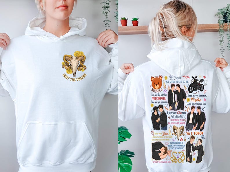 May include: White hoodie with a front graphic of a ram skull and yellow roses, with the text "HUNT THE VILLAIN". The back features a collage of illustrations and text, including the words "Mishka" and "Ya's Toboy".