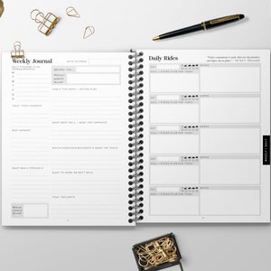 May include: A weekly journal with a black and white design. The left page has a section for "Weekly Journal" and the right page has a section for "Daily Rides".