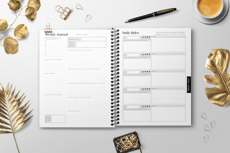 May include: A weekly journal with a black and white design. The left page has a section for "Weekly Journal" and the right page has a section for "Daily Rides".