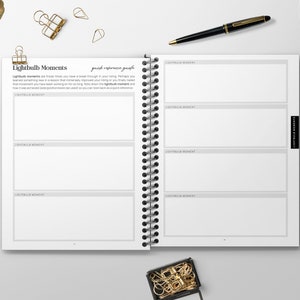 May include: A white spiral bound journal with the title "Lightbulb Moments" and the text "quick reference guide". The journal has blank pages for writing down ideas and thoughts.