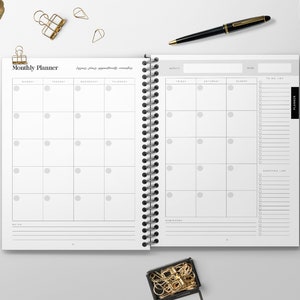 May include: A white monthly planner with a black spiral binding. The planner has a calendar section with days of the week and a to-do list section. The planner has the words "Monthly Planner" at the top.