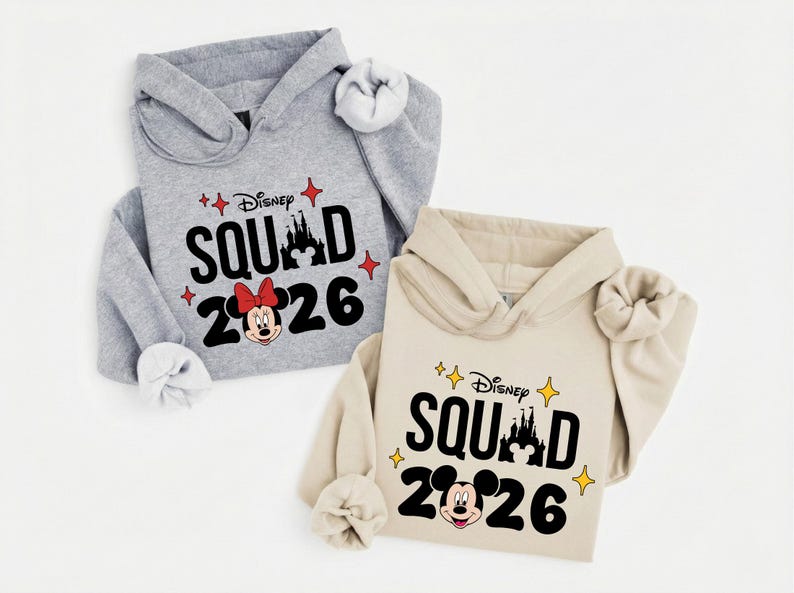 two Disney-themed hoodies, one gray and one beige, with the text "Disney SQUAD 2026" printed on them.