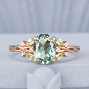 Anillo de compromiso único de zafiro verde ovalado, oro rosa, estilo vintage, para mujer, con diseño de racimo de peridoto y forma de rama. Regalo perfecto para ella.
