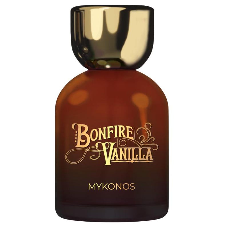 May include: A brown glass perfume bottle with a gold cap. The bottle has the words "Bonfire Vanilla" in gold script, with "Mykonos" below. The bottle has a rounded shape.