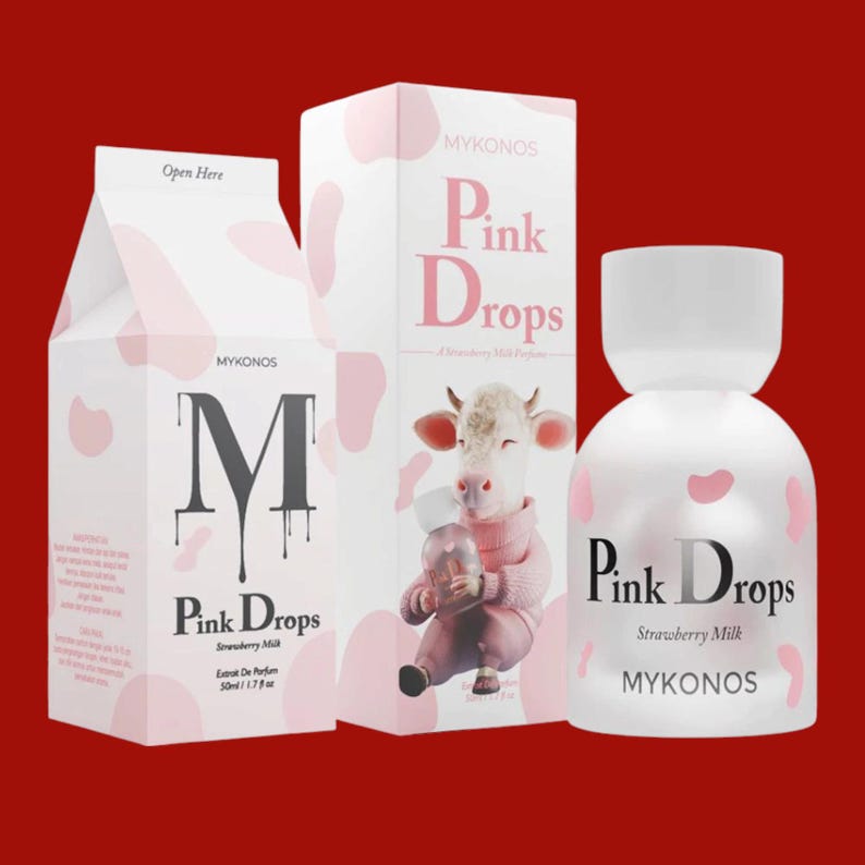 May include: A perfume bottle and two boxes with the text "Pink Drops Strawberry Milk" and "Mykonos" on a red background. The boxes and bottle are white with pink cow-like spots. One box has a cow illustration.