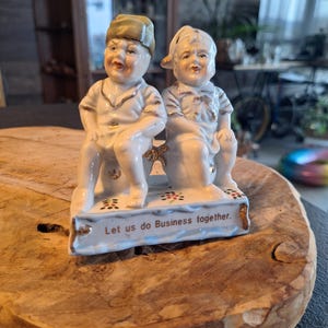 Antique German Fairing Figurine depicts two boys sitting on a chamber. 1850-1899 time. Free delivery.
