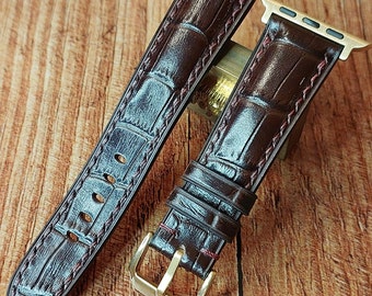 Embossed Alligator Leather Apple Watch Band: Hand-stitched Dark Brown Strap with smart watch connectors.