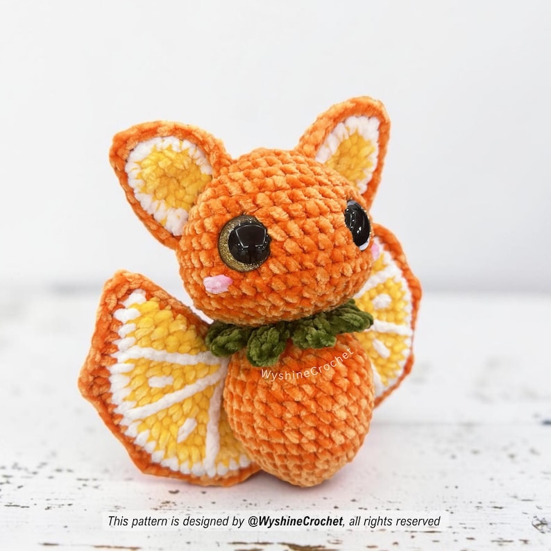 Orange Bat Crochet Pattern finished amigurumi plushie with citrus wings, orange body, and cozy autumn Halloween style
