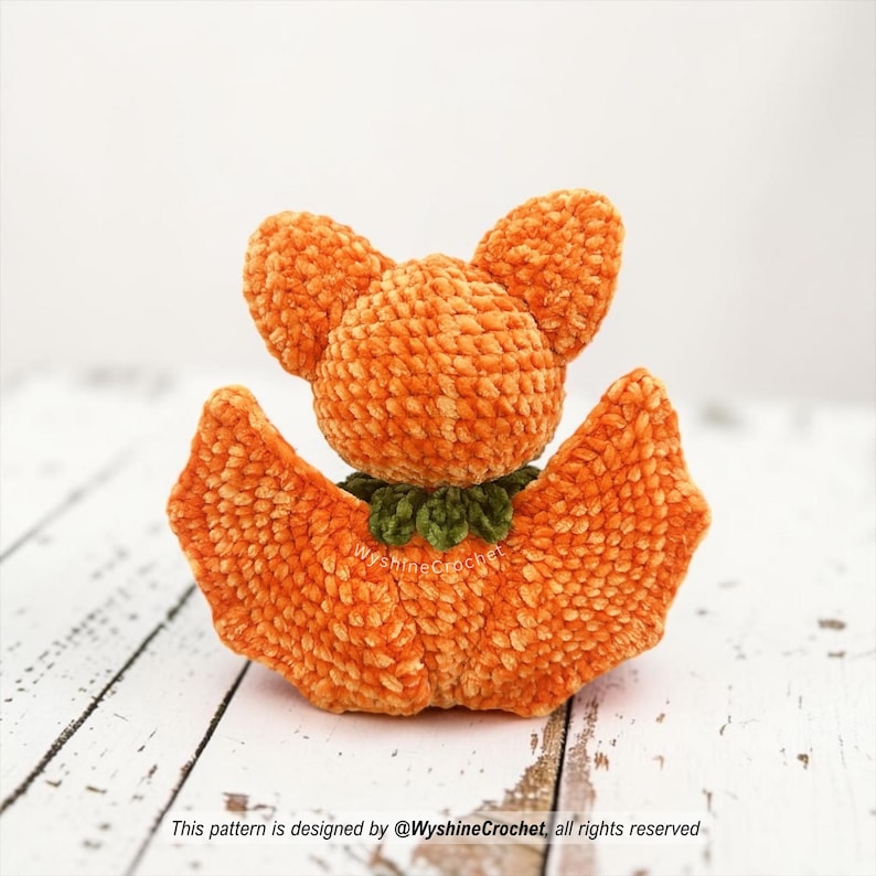 Orange Bat Crochet Pattern finished amigurumi plushie with citrus wings, orange body, and cozy autumn Halloween style