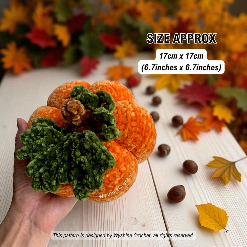 May include: A handmade orange crochet pumpkin with green leaves and a brown stem. The pumpkin measures approximately 6.7 inches by 6.7 inches. The background includes fall leaves and chestnuts. Text on the image reads "Wyshine Crochet".
