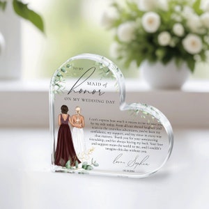 May include: A heart-shaped crystal keepsake with a floral design and a message to a maid of honor. The text reads "To my Maid of Honor on my Wedding Day." The message continues with a heartfelt message of appreciation and love. The date "05.10.2024" is also included.