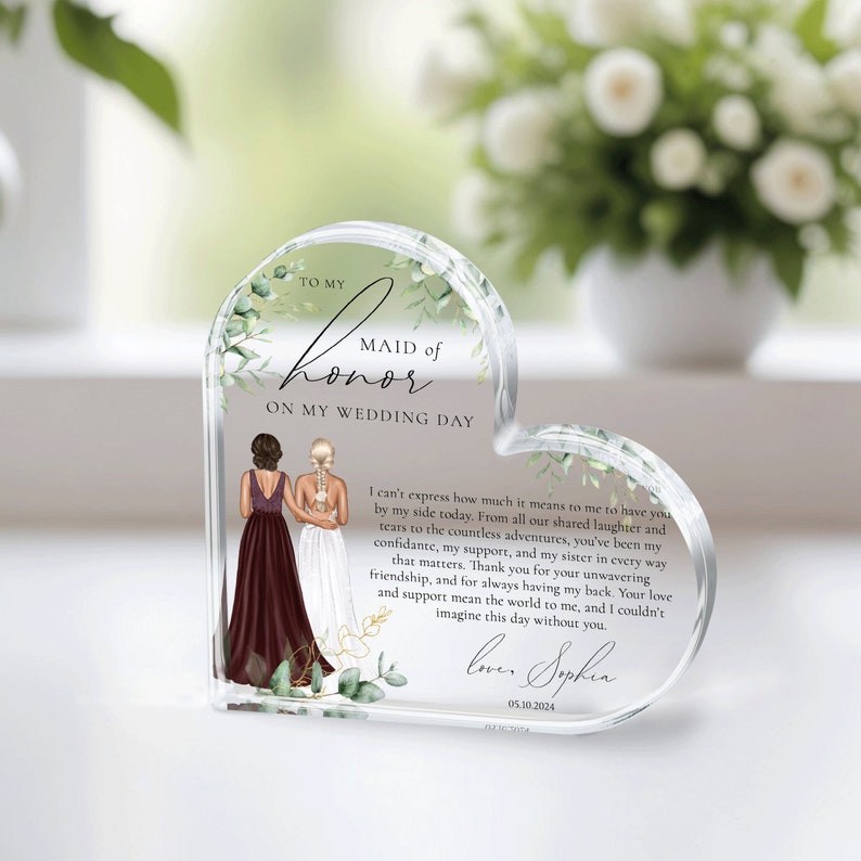 May include: A heart-shaped crystal keepsake with a floral design and a message to a maid of honor. The text reads "To my Maid of Honor on my Wedding Day." The message continues with a heartfelt message of appreciation and love. The date "05.10.2024" is also included.