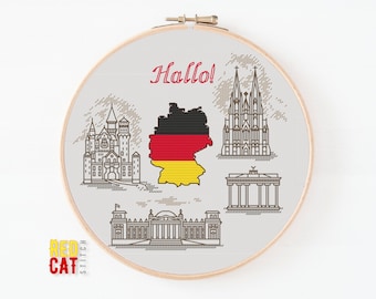 May include: A cross-stitch pattern featuring iconic German landmarks, including Neuschwanstein Castle, Cologne Cathedral, Brandenburg Gate, and the Reichstag Building. The pattern also includes the German flag and the word "Hallo!" in red.