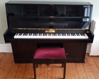 Beautiful Upright Perzina Piano in Black finish. Model GP112  /118