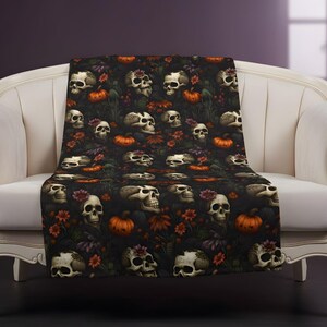 Halloween Skull throw blanket draped over a gothic chair.