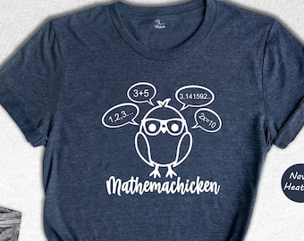 May include: A navy blue t-shirt with a white graphic of a chicken wearing glasses and thinking about math equations. The text "Mathemachicken" is printed below the chicken.