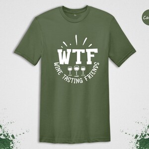 May include: A green t-shirt with the text "WTF Wine Tasting Friends" in white. The text is in a circle with three wine glasses in the center.