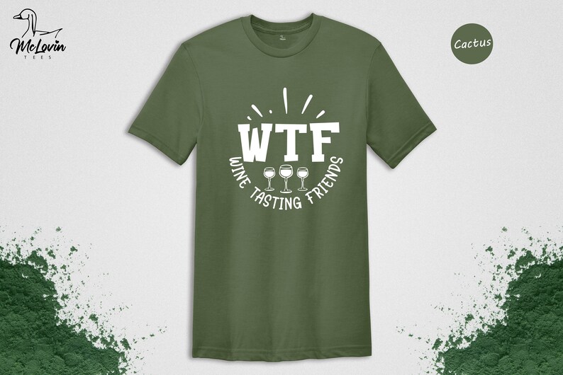 May include: A green t-shirt with the text "WTF Wine Tasting Friends" in white. The text is in a circle with three wine glasses in the center.