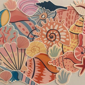 May include: A collection of colourful seashell stickers with various designs, including coral, starfish, and seashells in pink, blue, yellow, and orange.